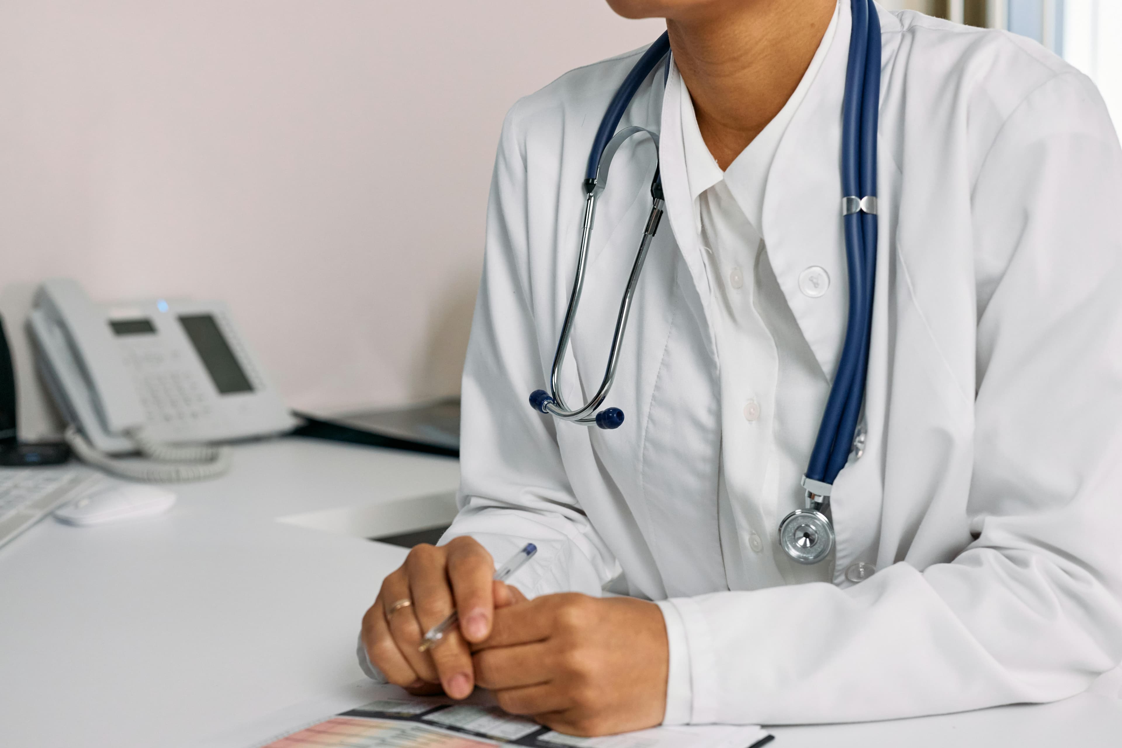 Physician demonstrating proper stethoscope placement at Erb's point