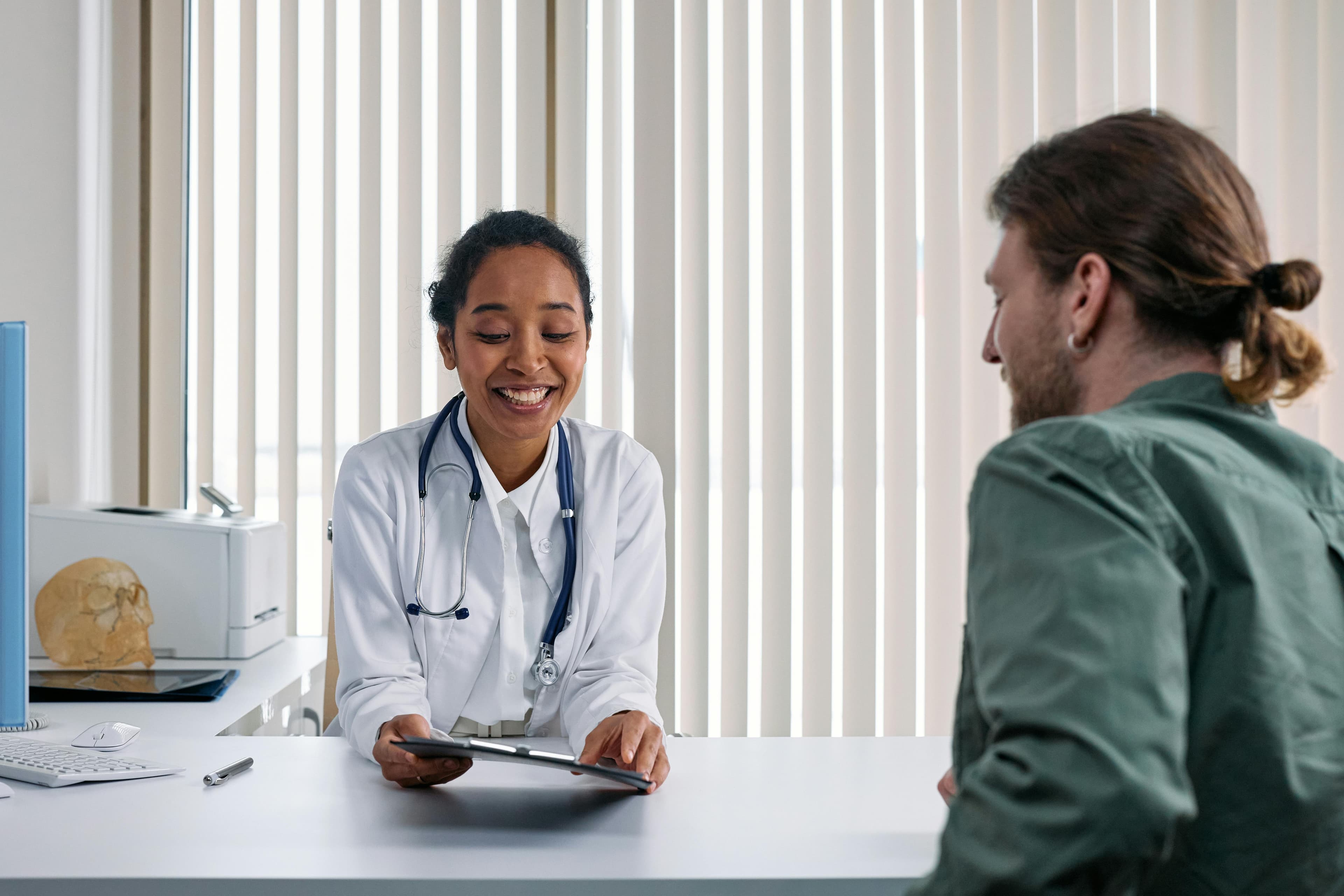 Doctor consulting with patient about post-operative care