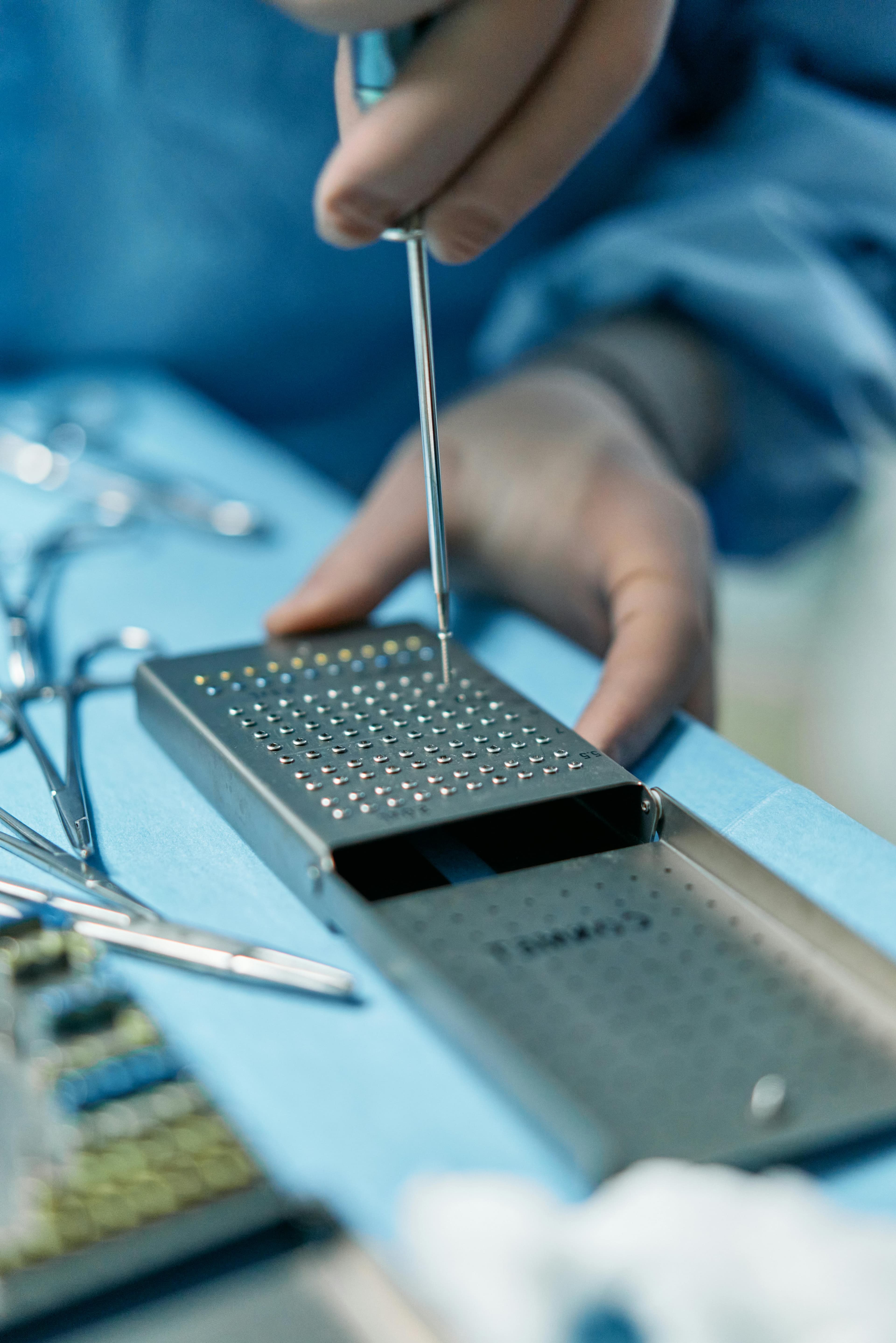 A surgeon performing minimally invasive hand surgery using advanced techniques and equipment
