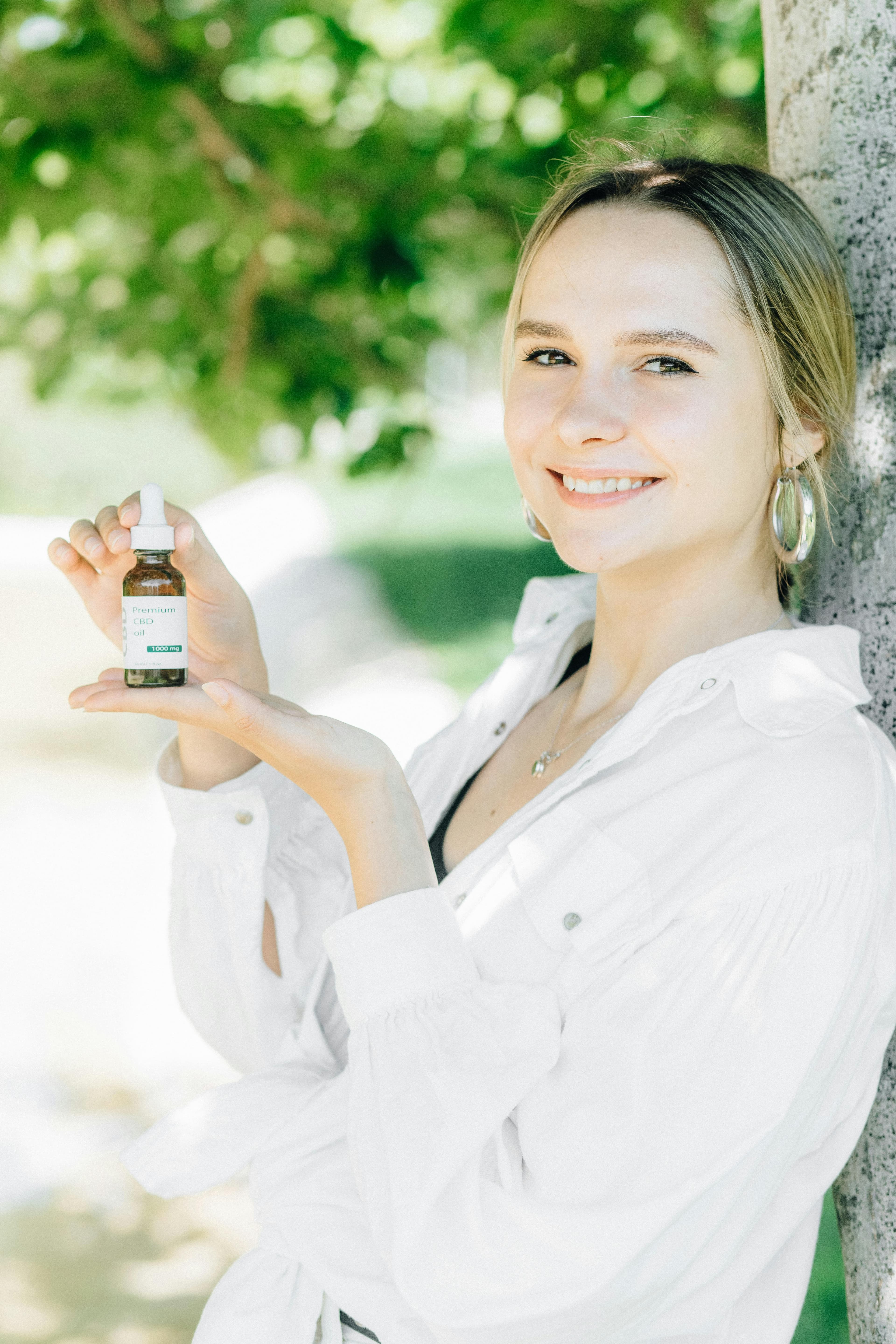 CBD oil dropper next to a human eye