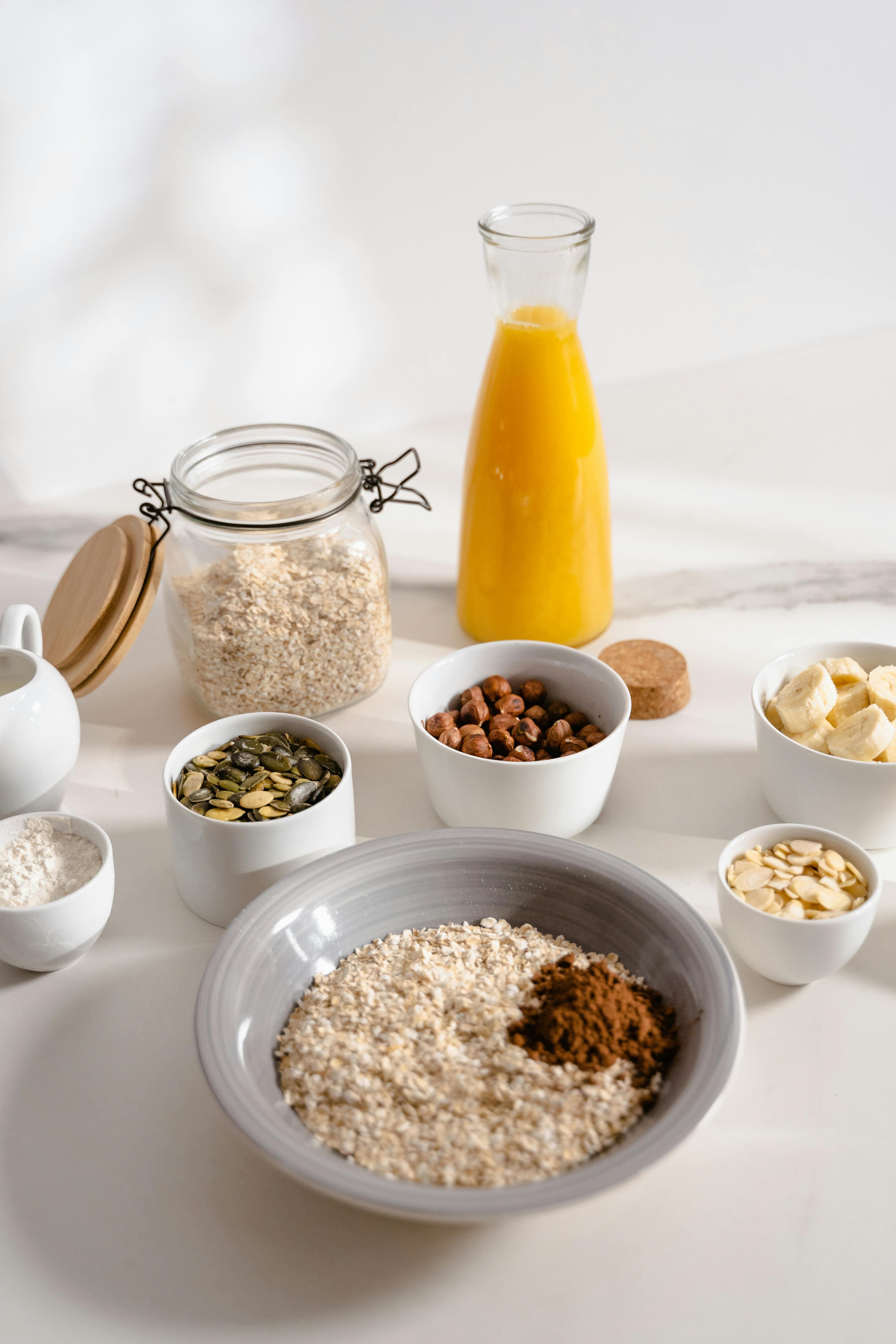 An assortment of plant-based milk alternatives including oat, rice, macadamia, and coconut milk