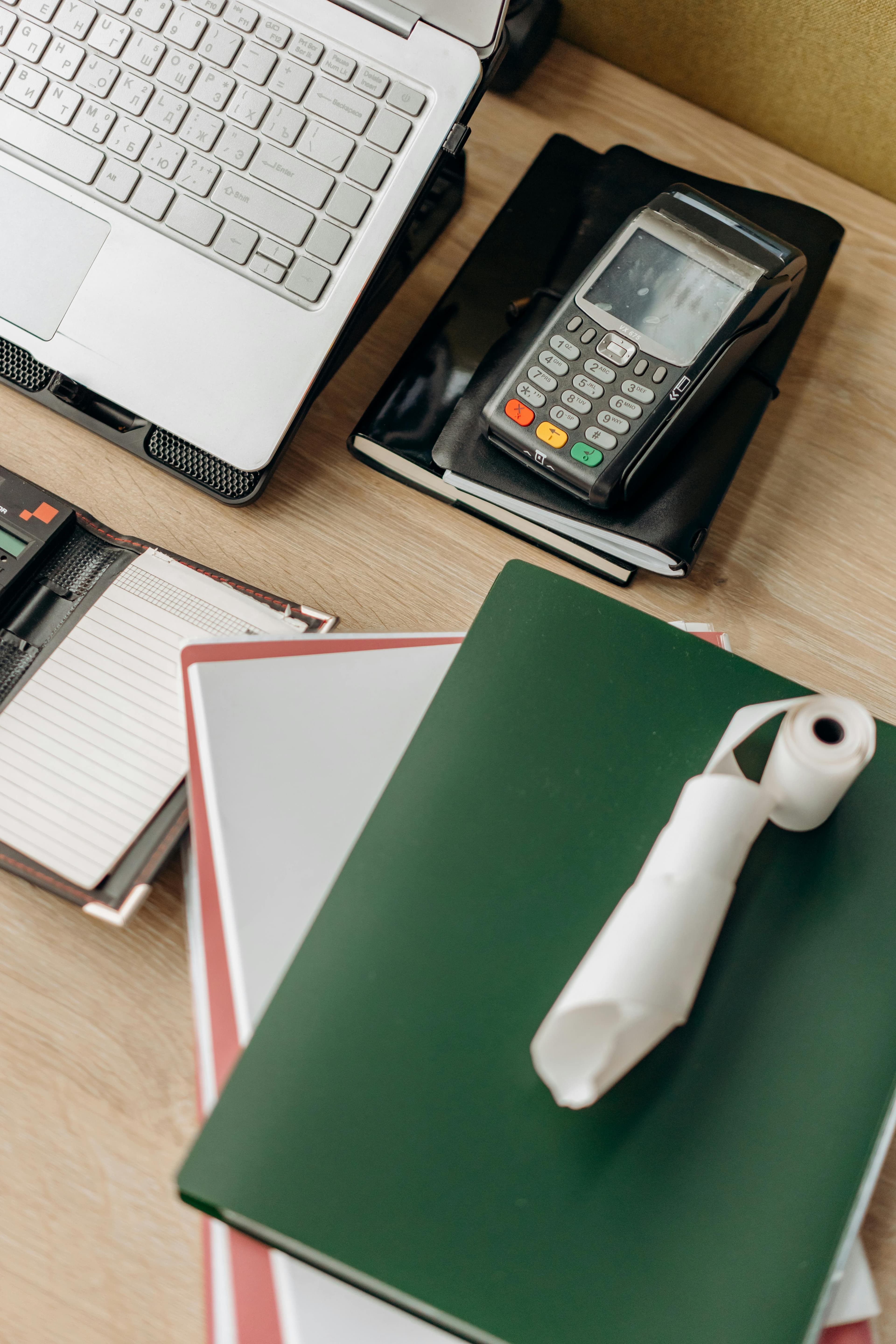 Stack of insurance paperwork and medical bills on a desk