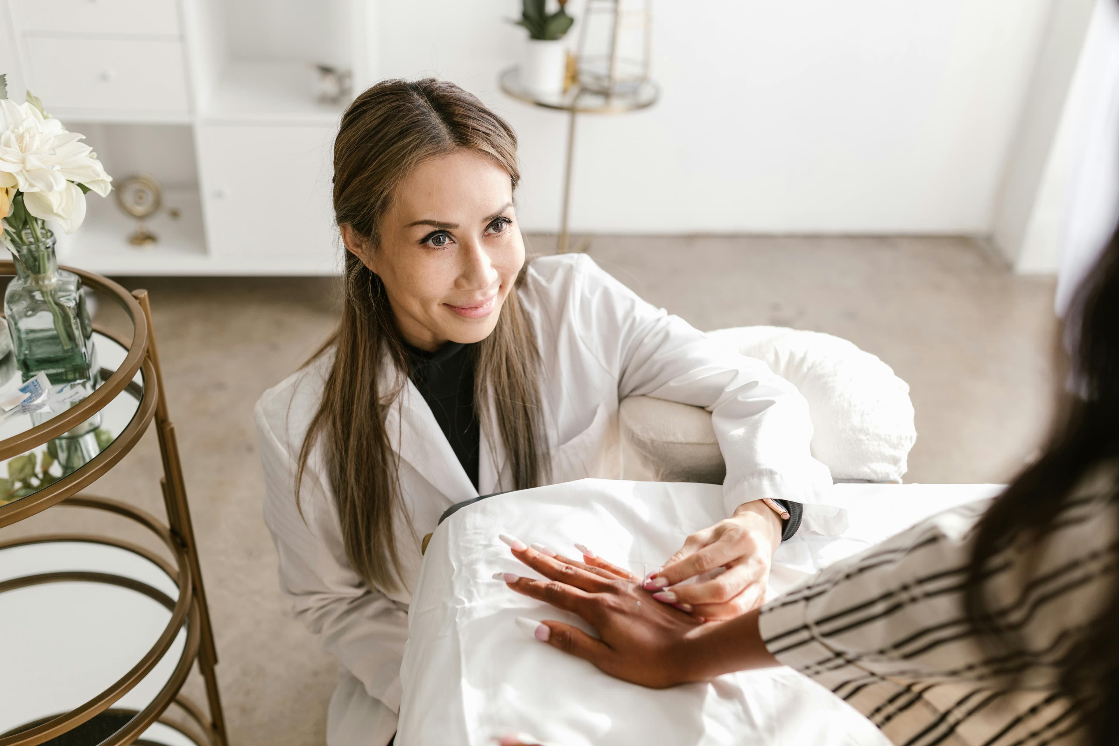 A patient receiving acupuncture treatment in a serene clinical setting