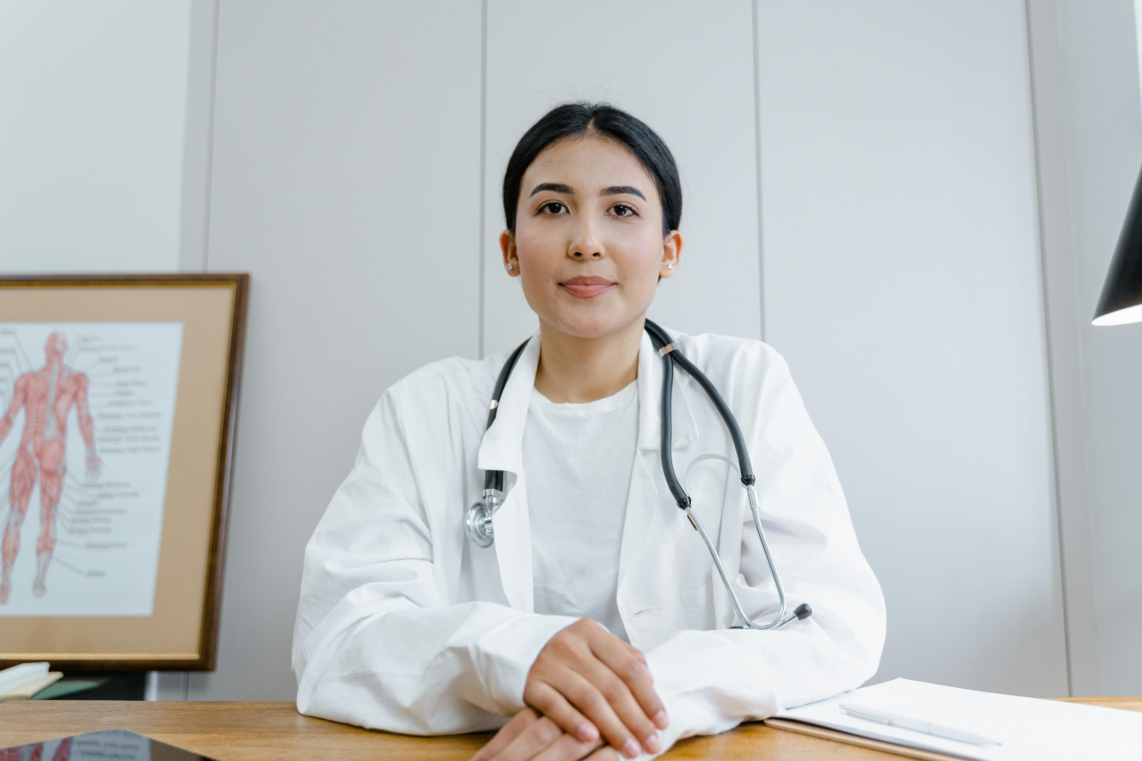 A female urologist consulting with a patient in a medical office