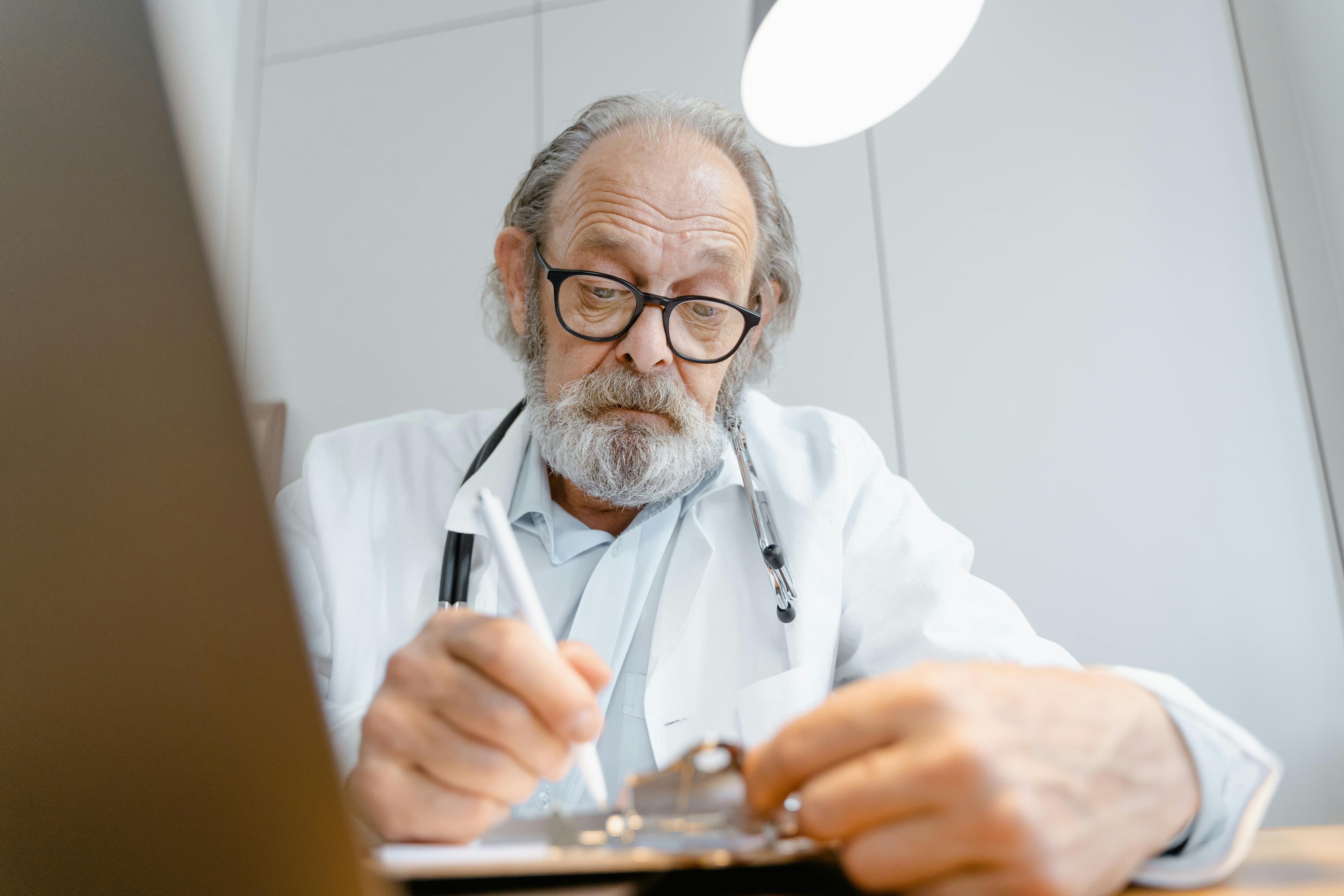 Doctor examining a patient for digestive issues