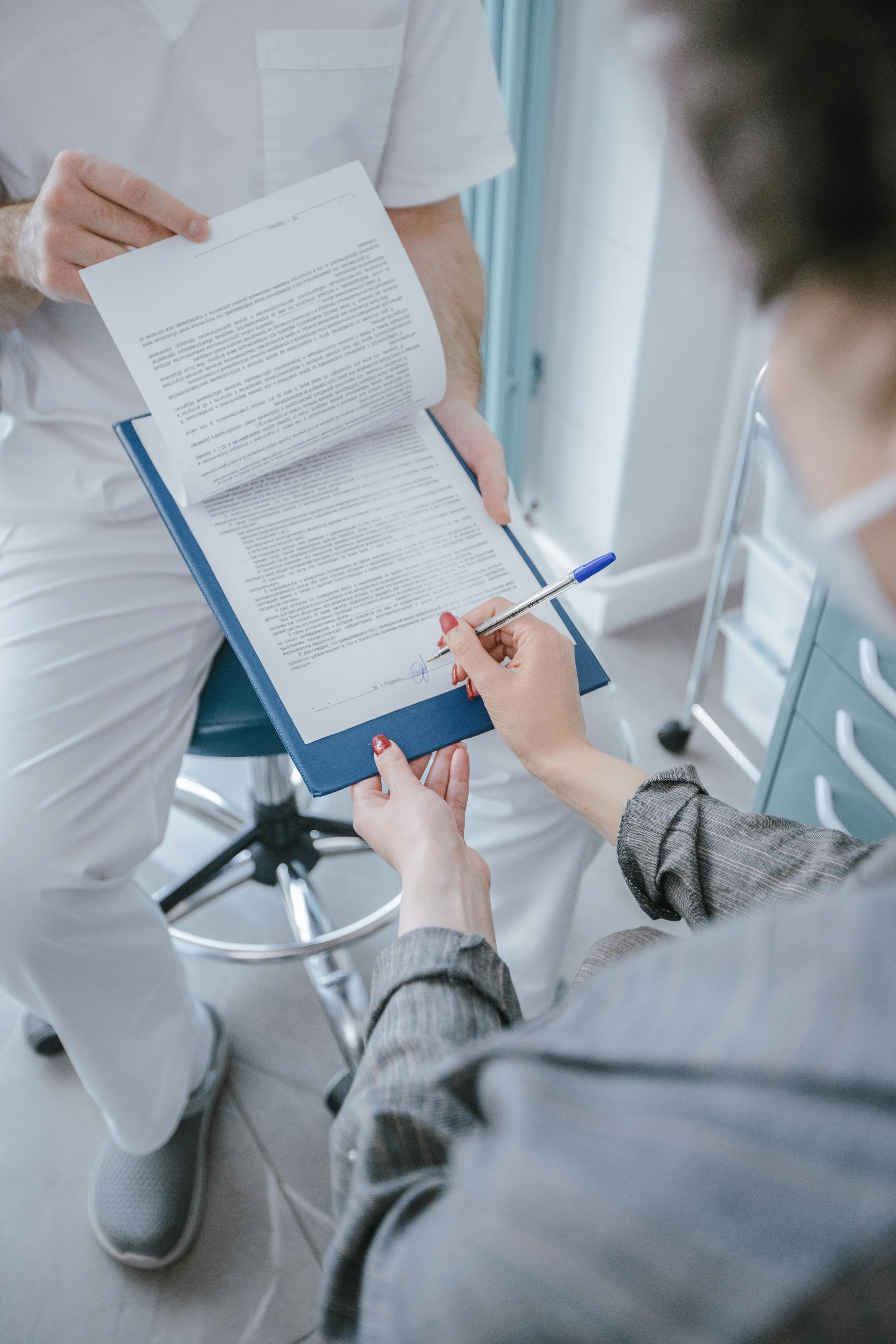 A doctor consulting with a patient before a hysteroscopy procedure
