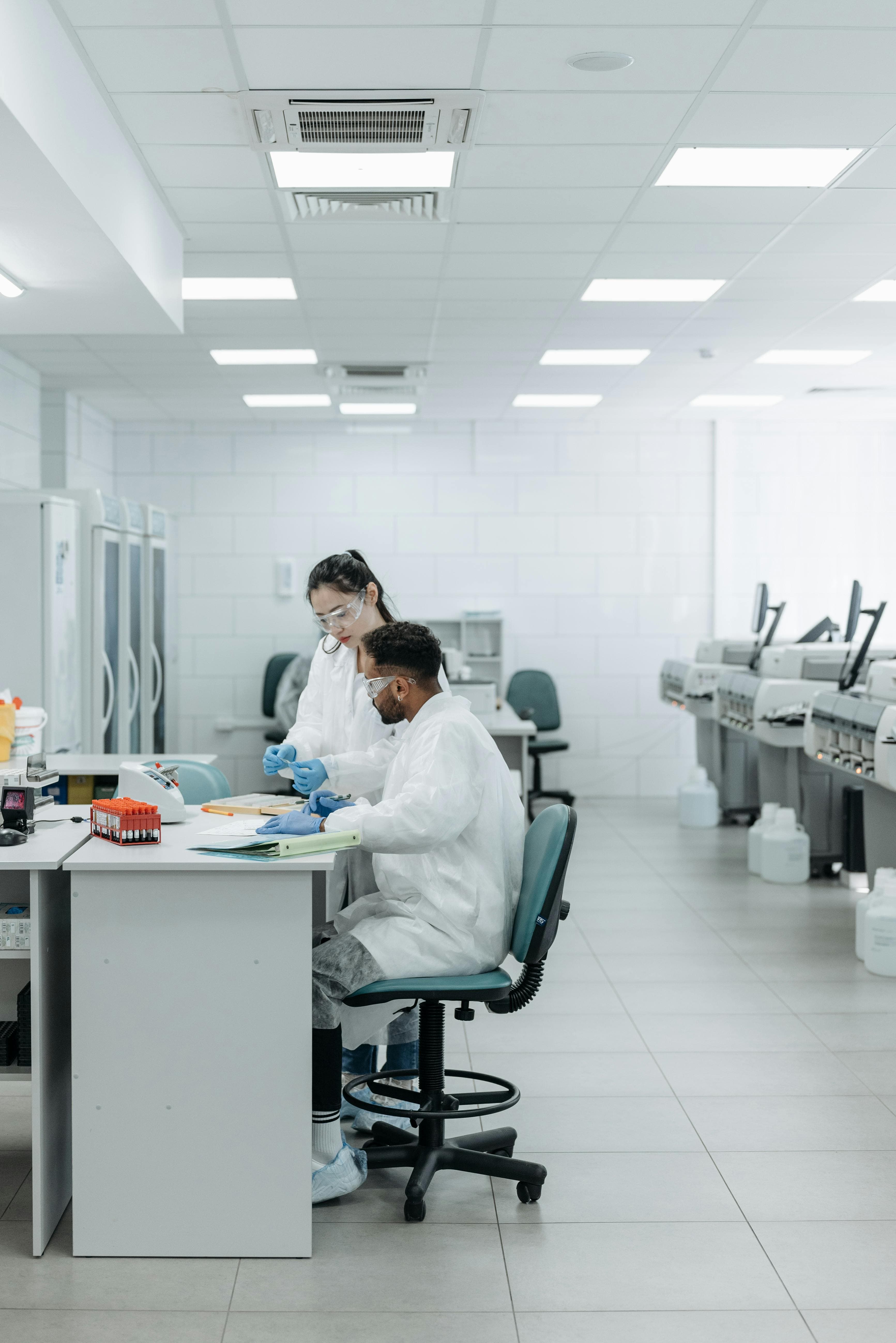 A modern laboratory setting with advanced diagnostic equipment and technicians analyzing samples