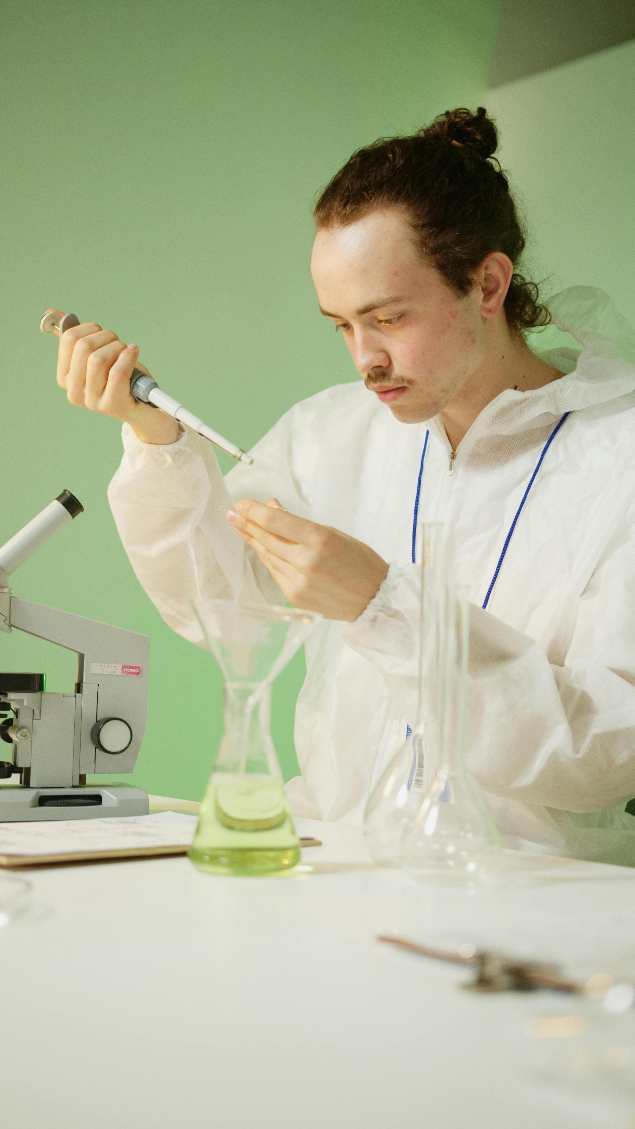 A pathologist examining tissue samples under a microscope, symbolizing the process of clinicopathological correlation