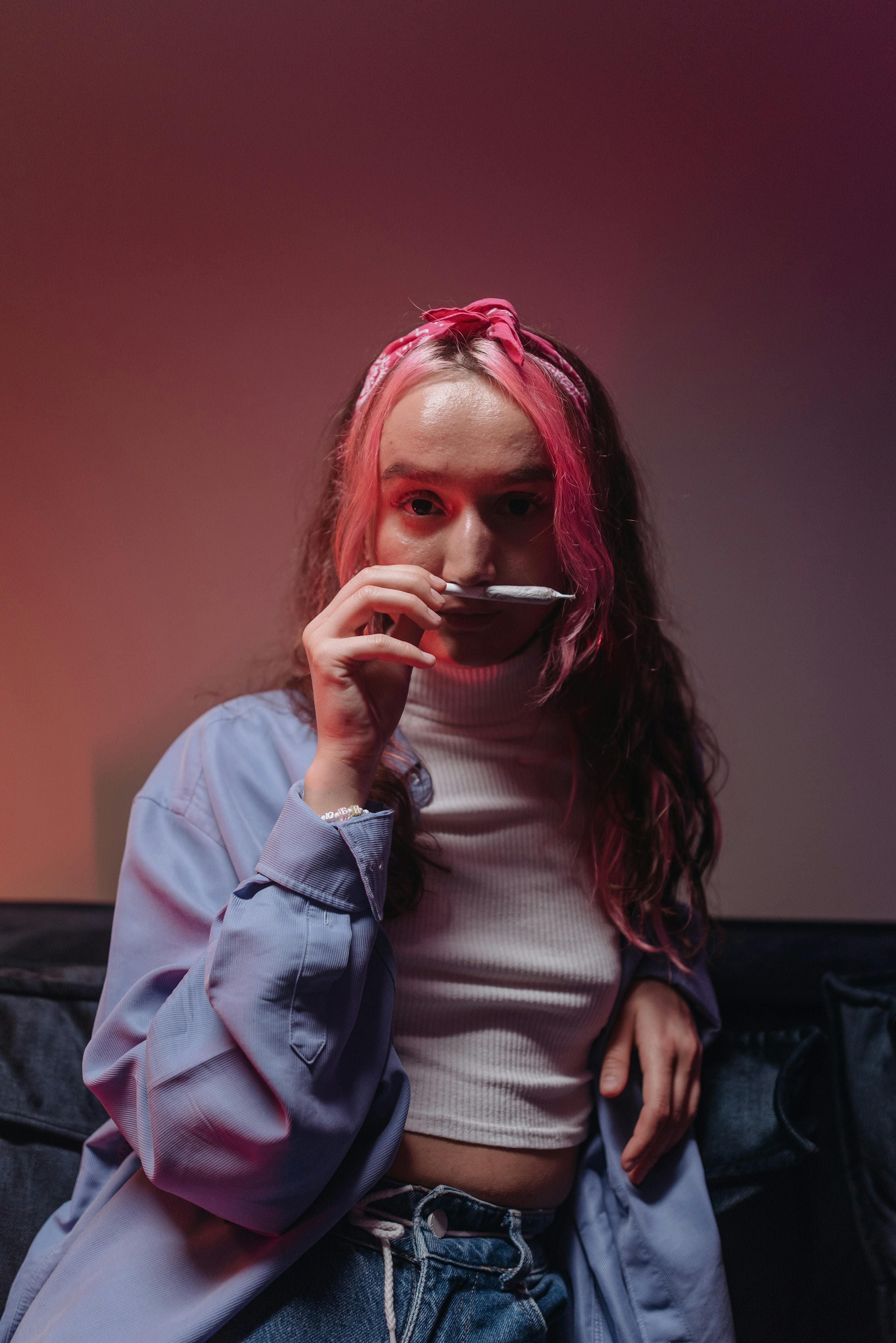 A person using a cannabis nasal spray