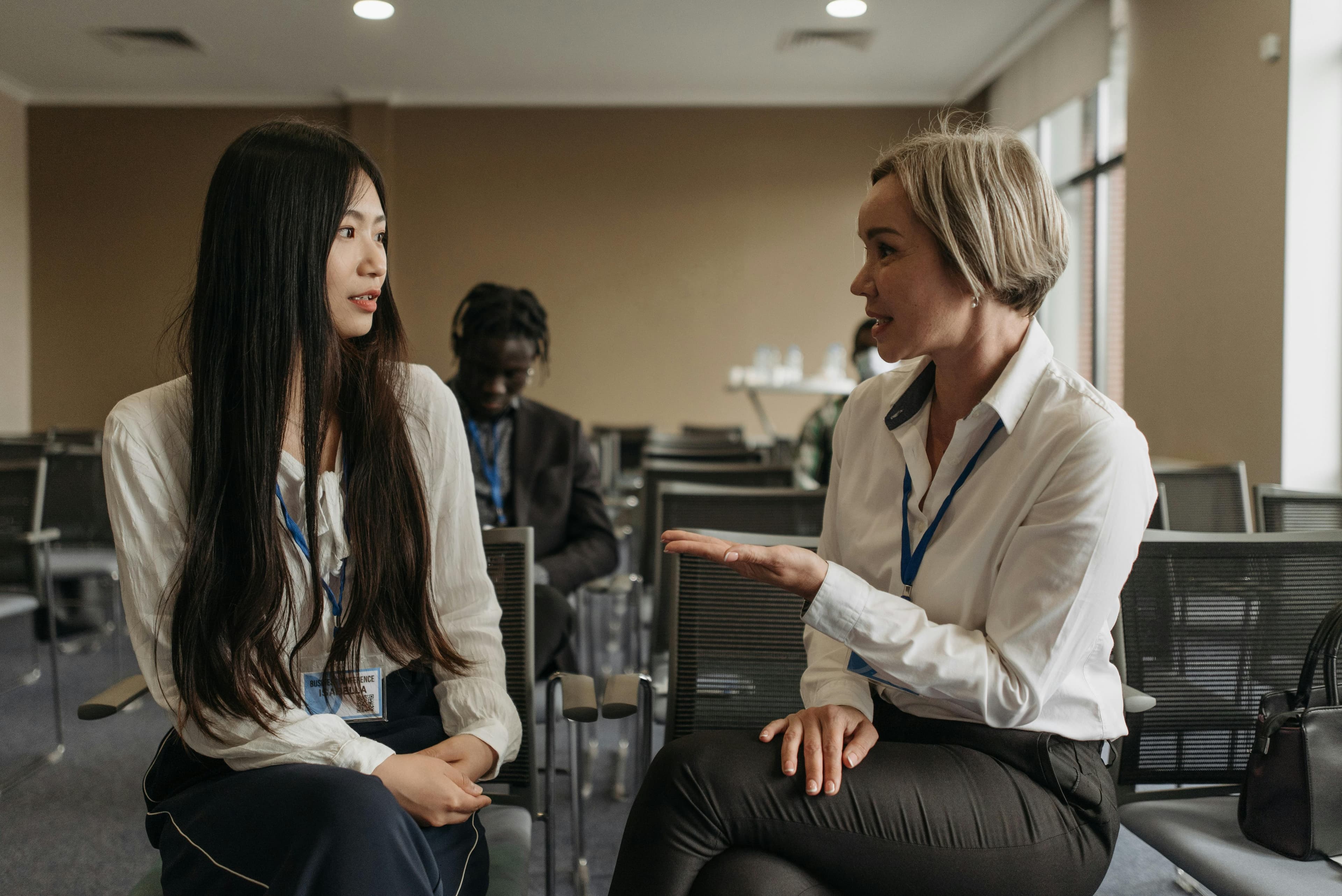 Attendees engaging in conversation during a conference networking session