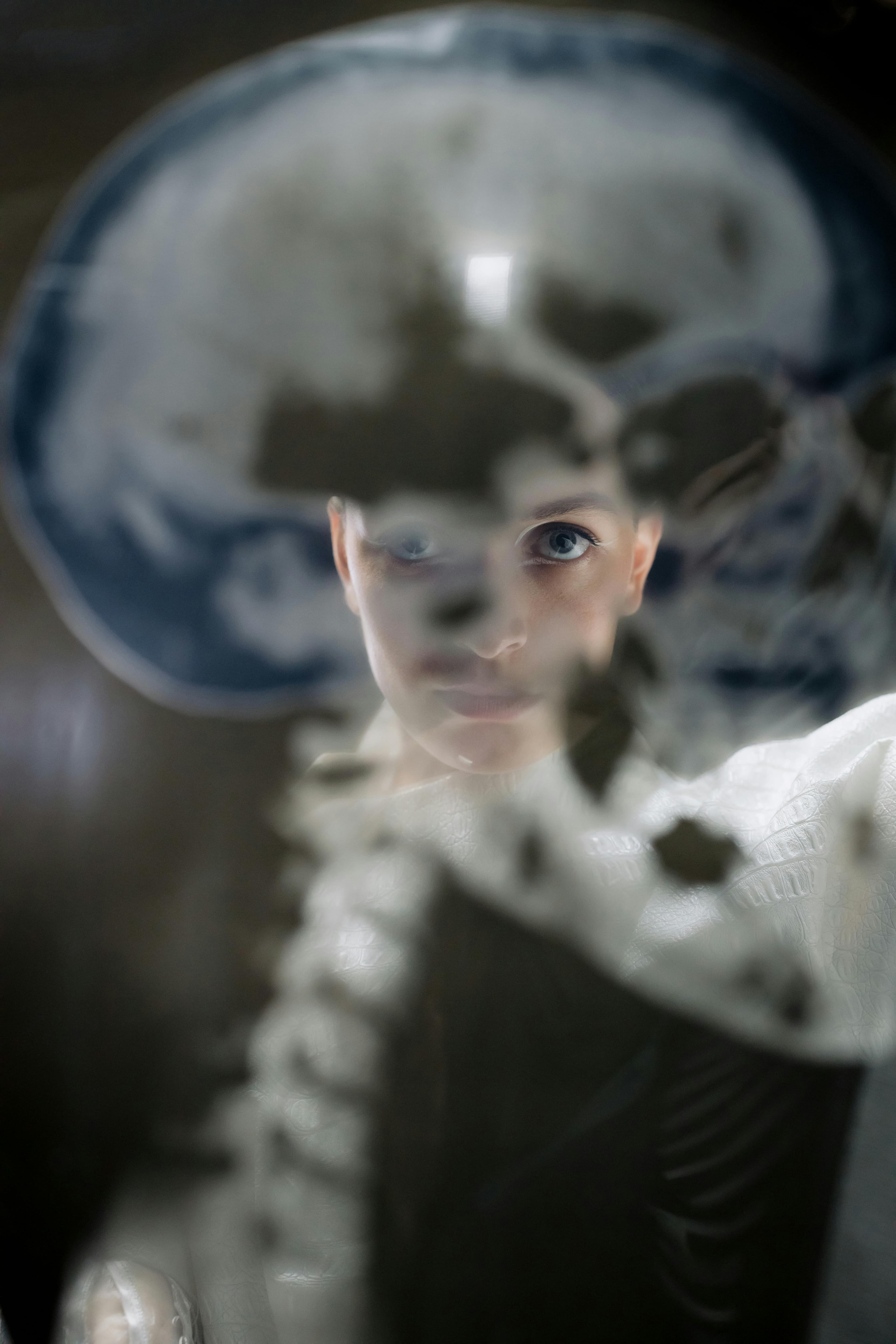 A scientist examining brain scans and neurological data in a laboratory setting