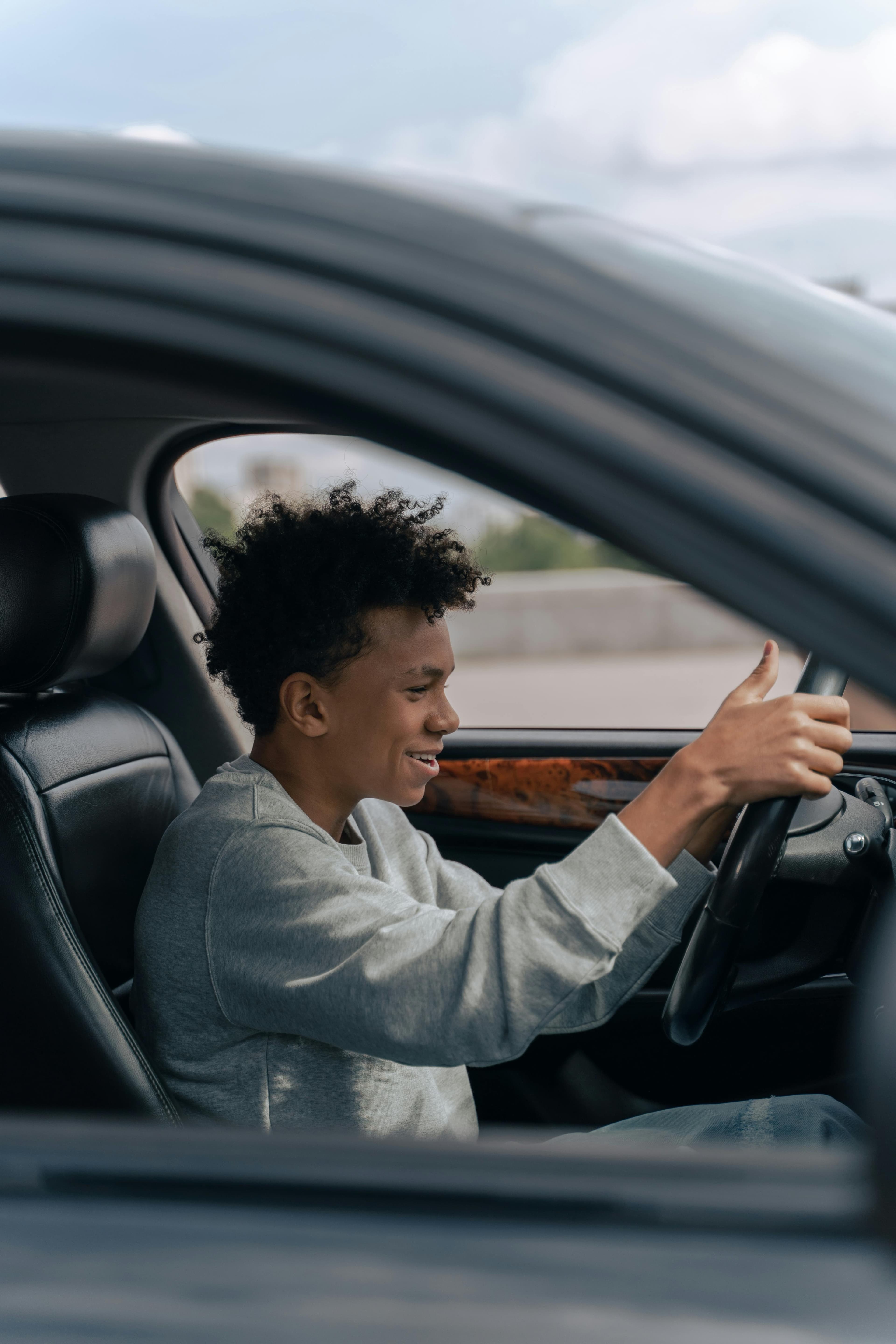 Person using a driving simulator to practice safe driving techniques after ankle injury