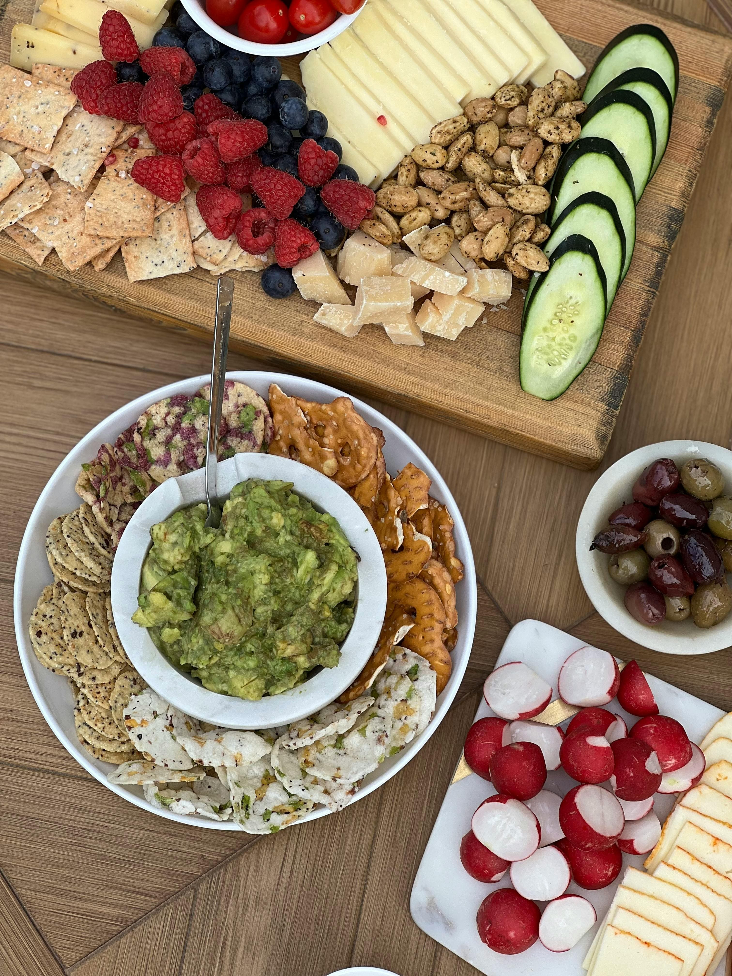 A variety of colorful fruits, vegetables, nuts, and lean proteins on a wooden table