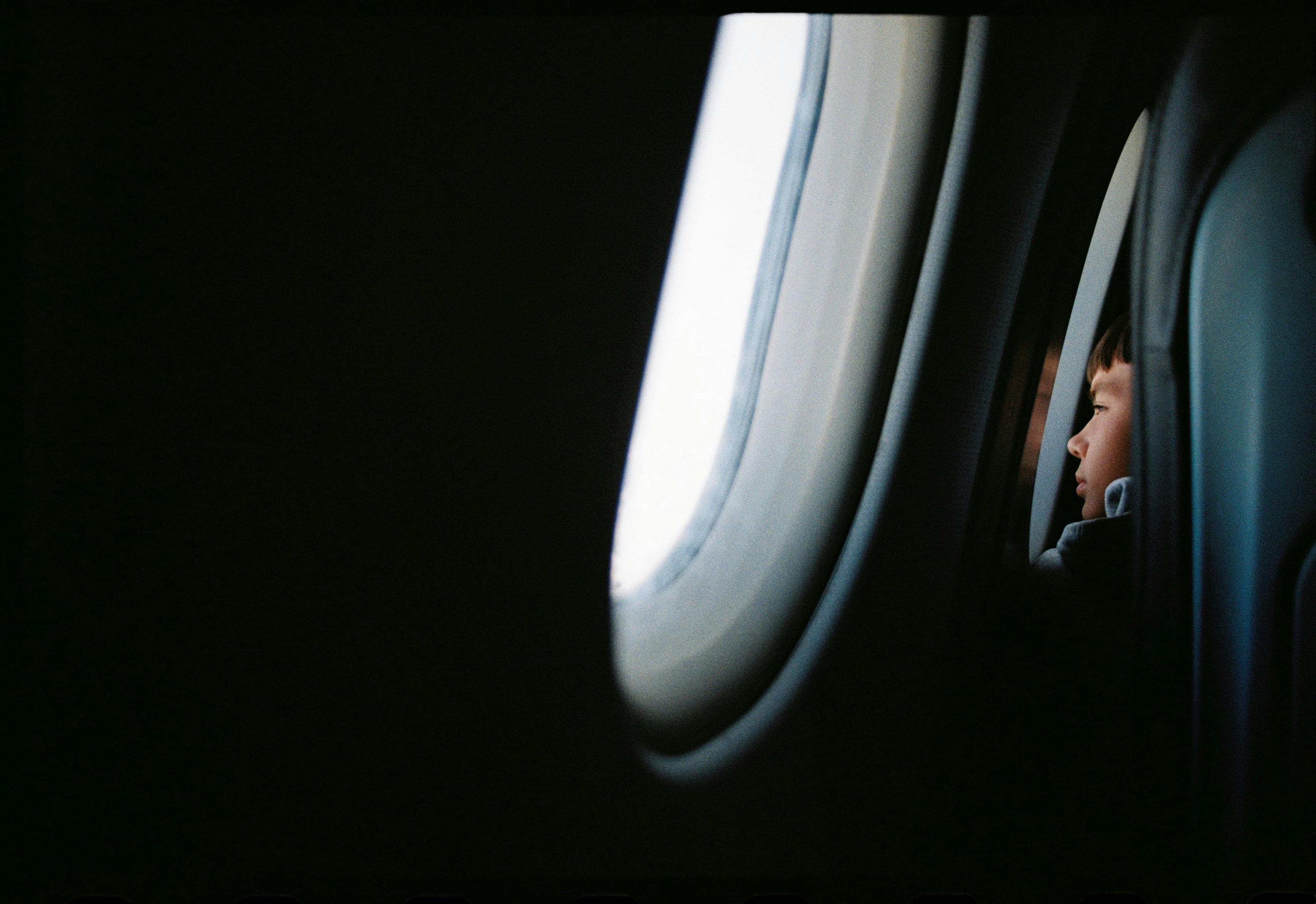 Passenger stretching in an airplane seat