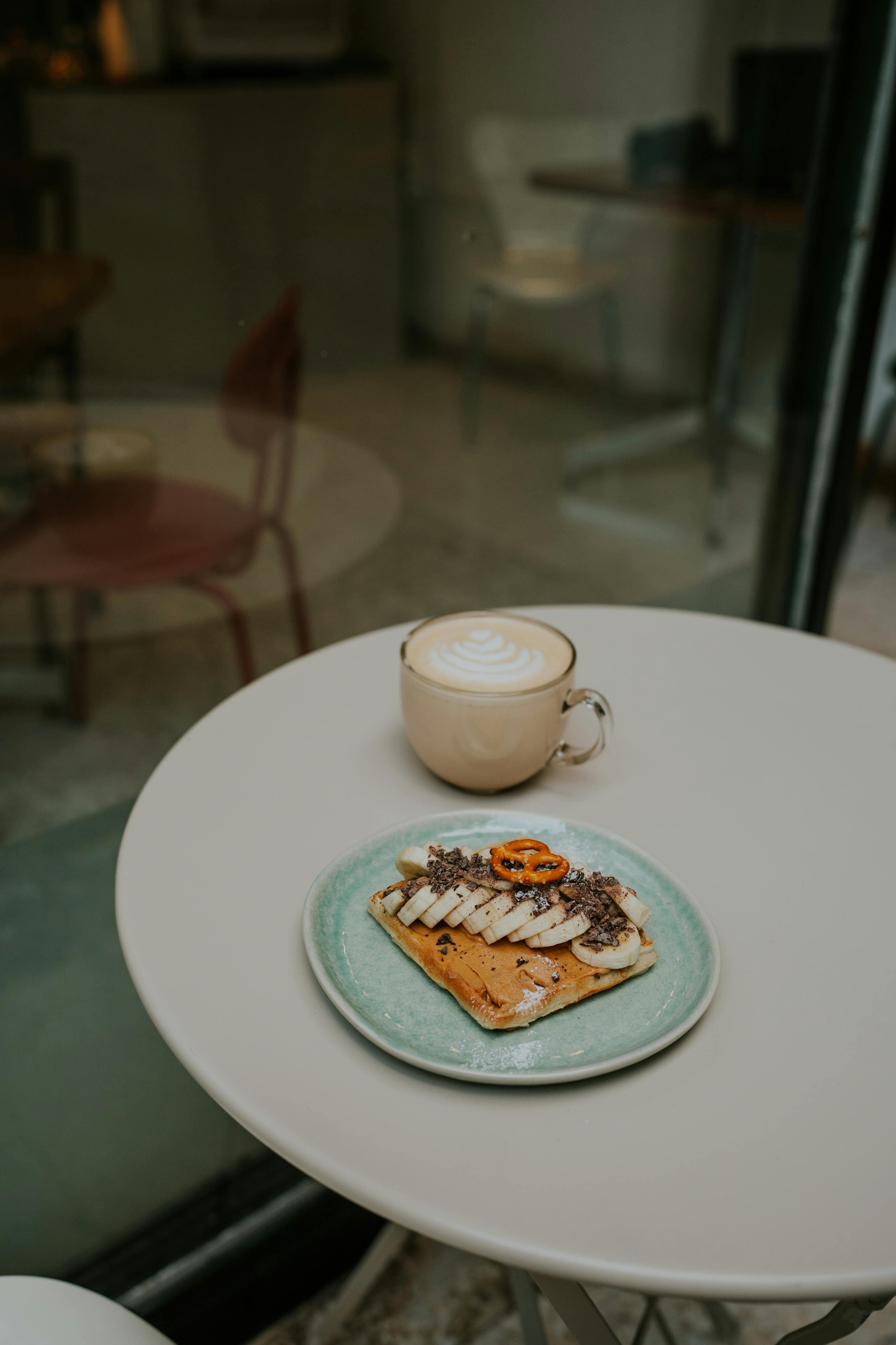 A plate filled with easily digestible foods like bananas, rice, and toast