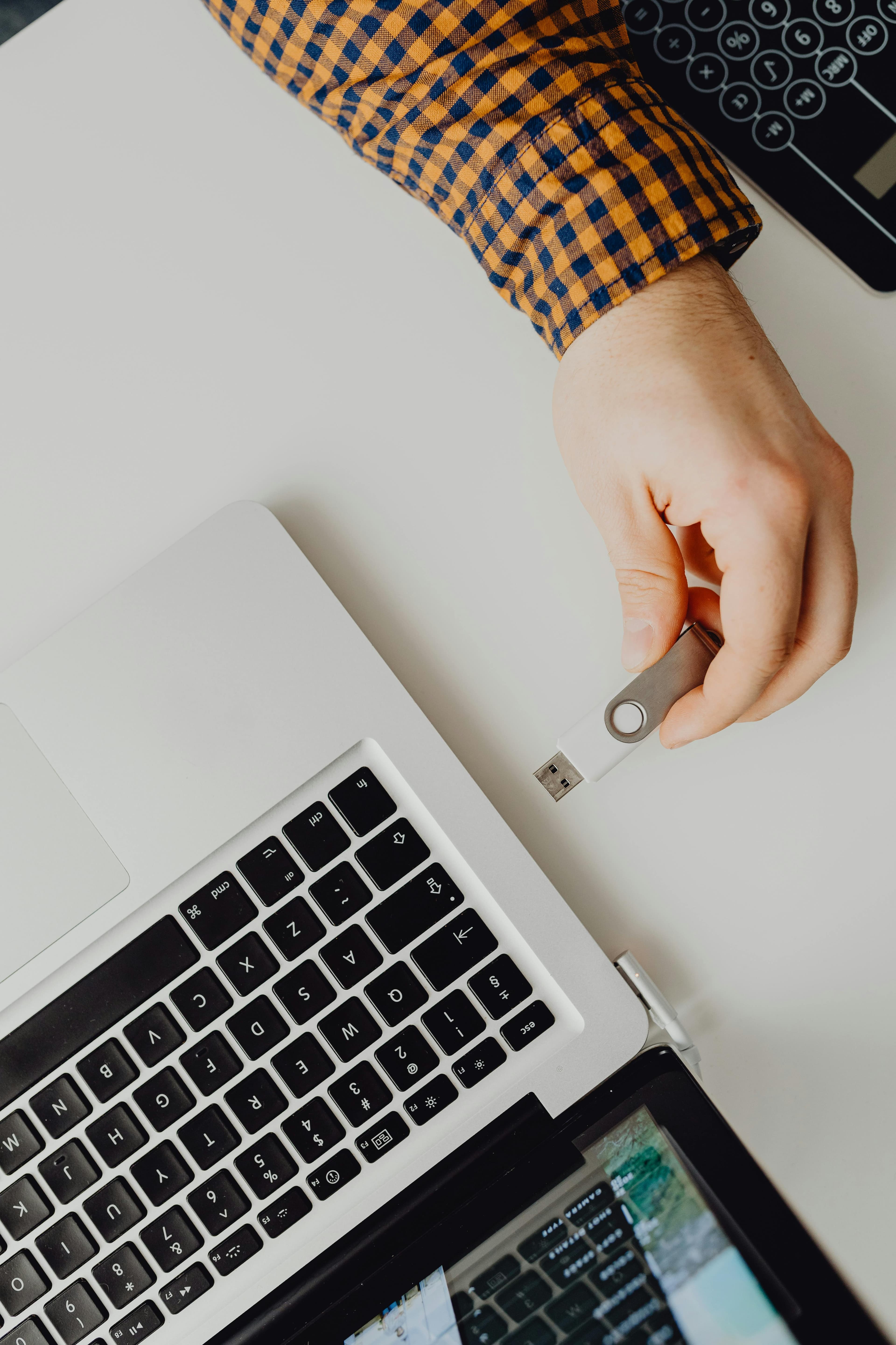 A portable peripheral DEXA device being used to scan a patient's wrist