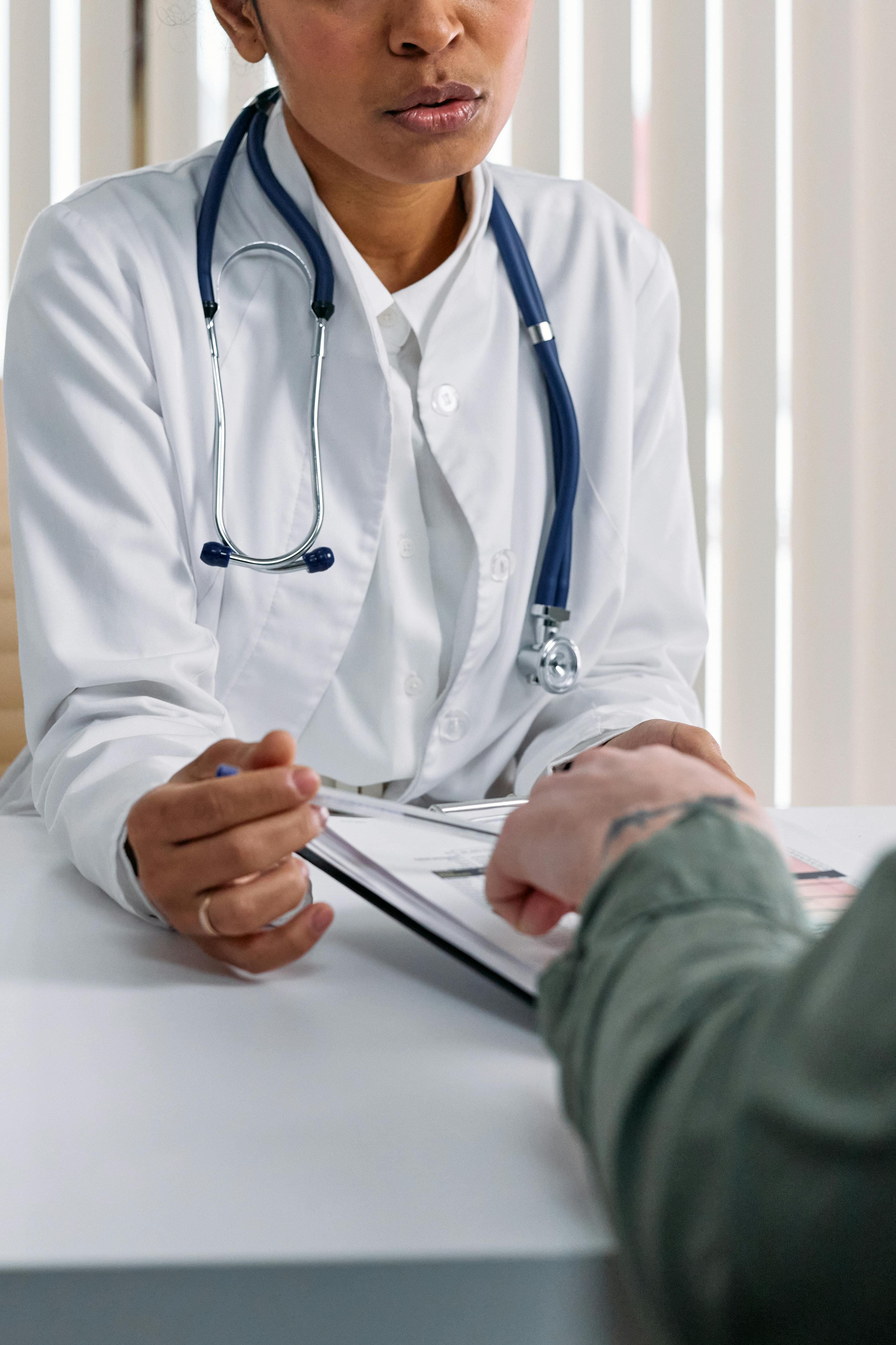Doctor discussing insulin options with a patient in an office setting