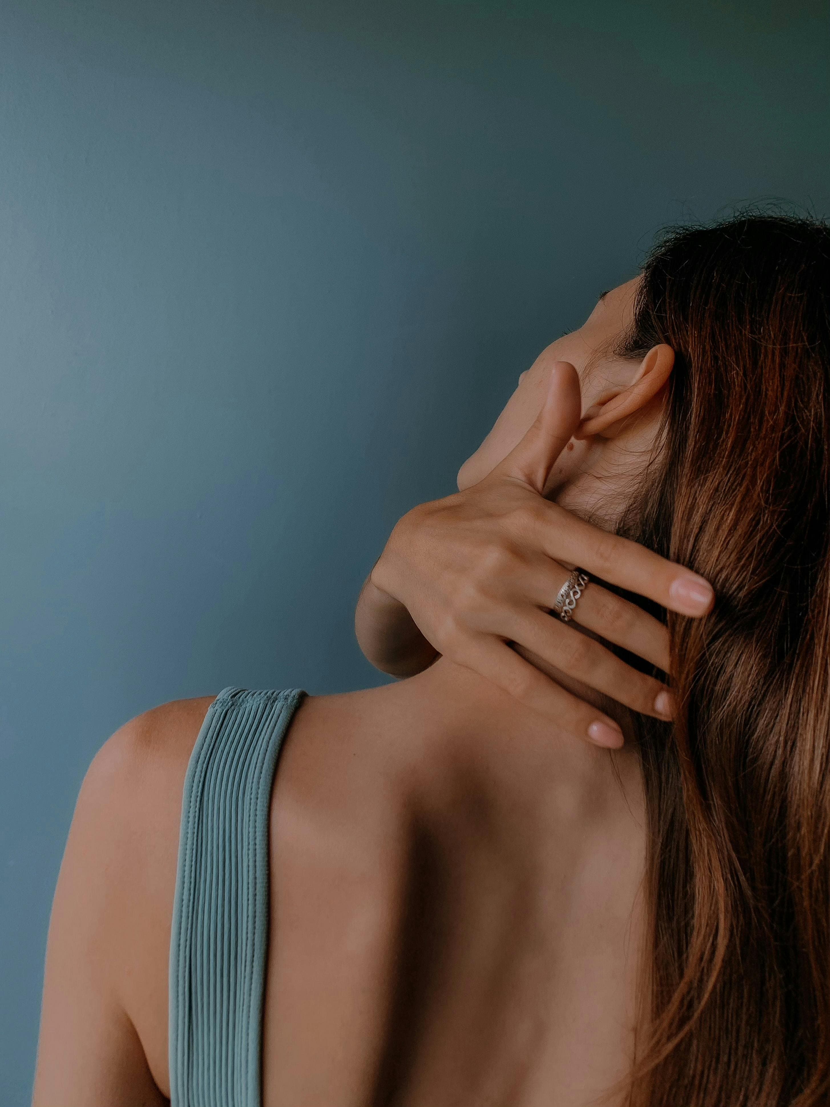 Person performing a gentle neck lateral flexion stretch