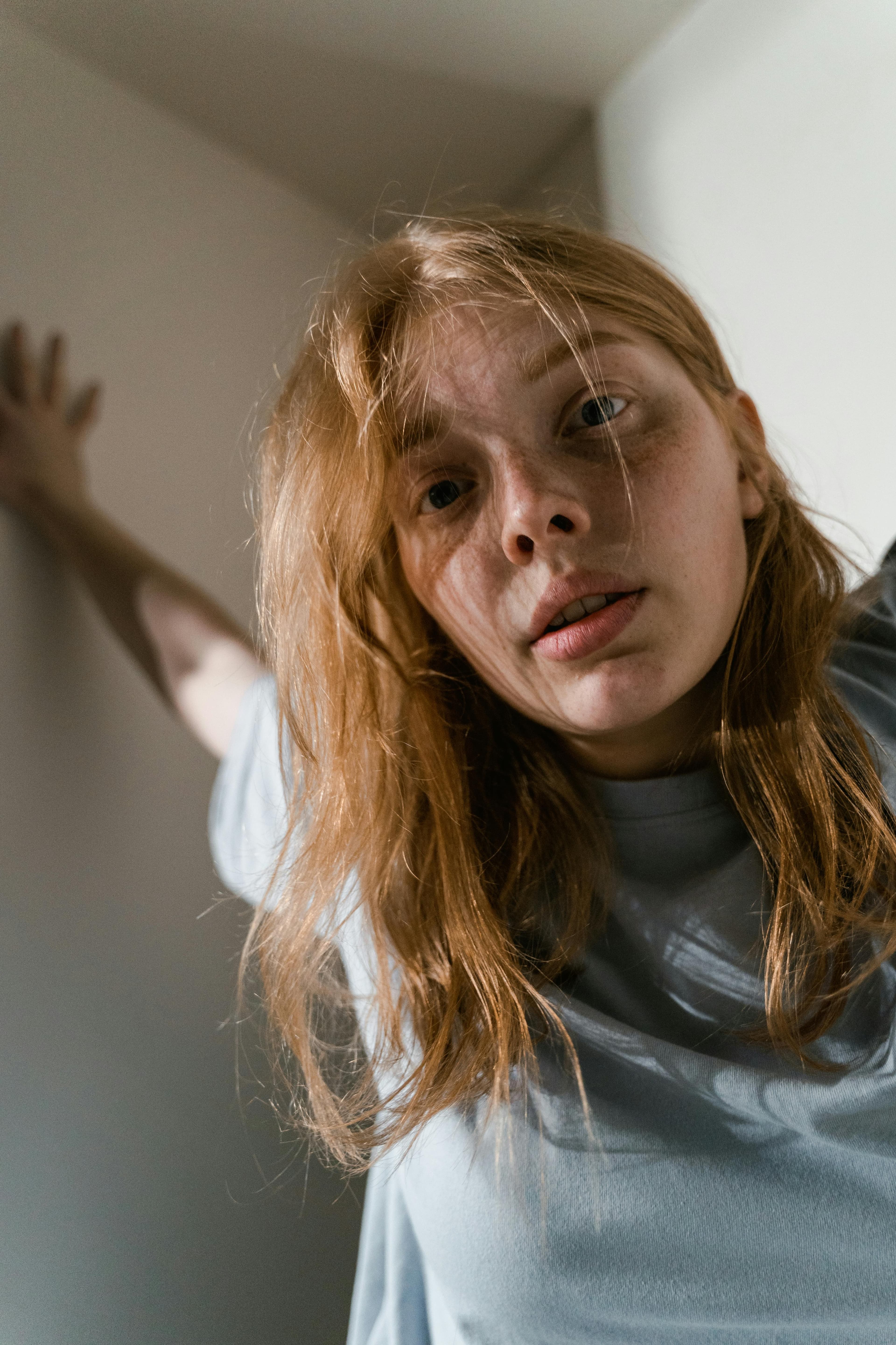 A woman looking anxious or worried, representing fear of gynecological exams